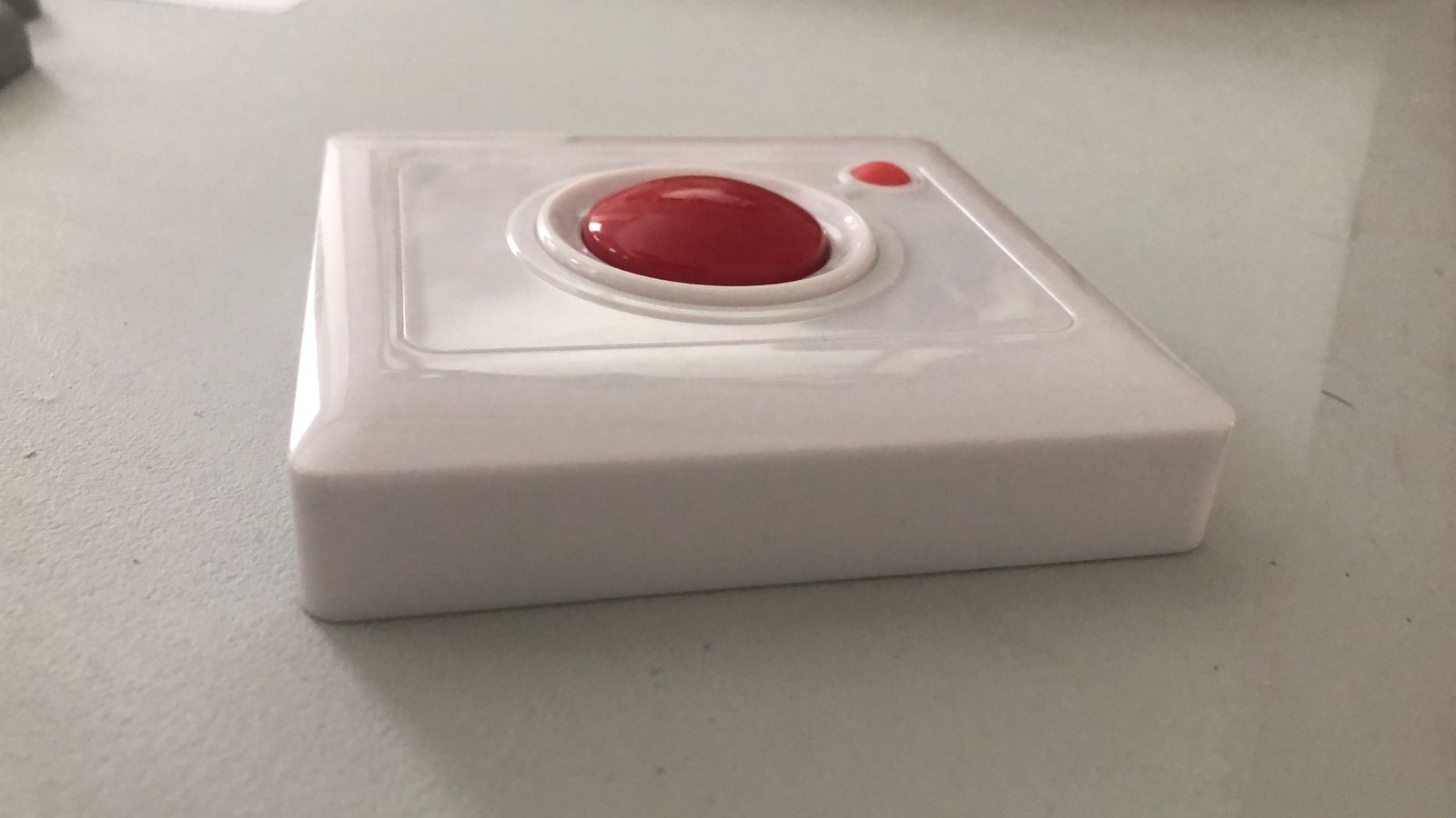 Side view of the BellMe B-SW2 showing the raised red call pad